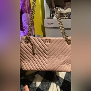 A XL Victoria secret pink purse with gold chain straps
